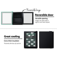 Reversible door feature demonstrated on Devanti mini fridge