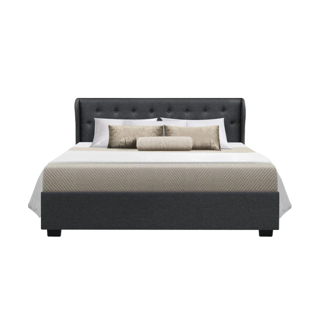 Opened gas lift storage under queen bed frame showing spacious compartment for hidden storage.