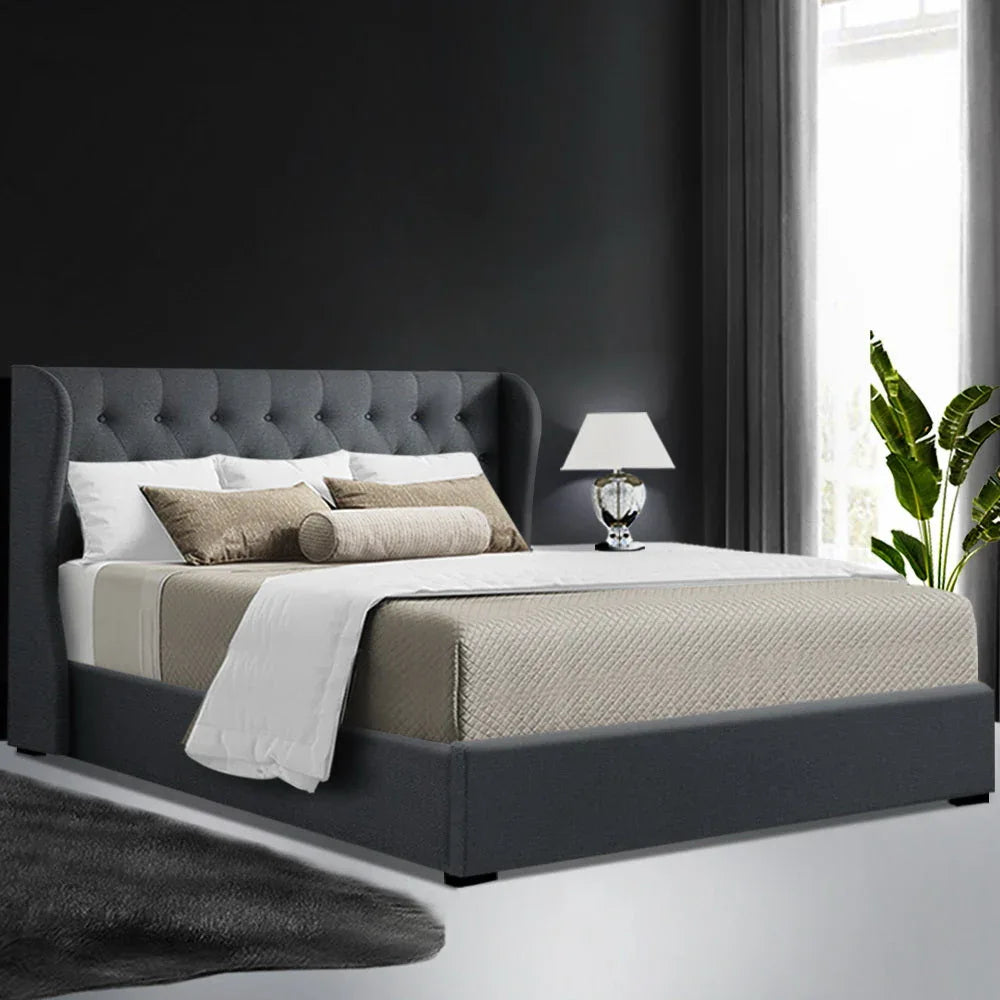 Queen bed frame fully opened showing large storage space beneath faux linen fabric frame.