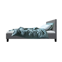Grey king single fabric bed frame with cushioning highlighting high-density foam padding.
