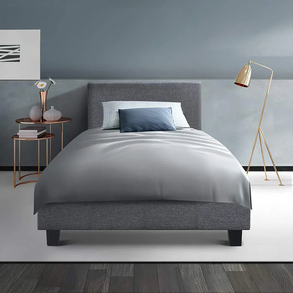 Modern grey fabric king single bed frame with plush headrest perfect for relaxing in bed.