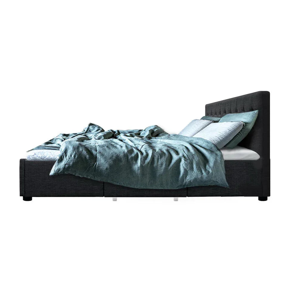 Under-bed wooden slat base providing mattress support on charcoal fabric bed frame.