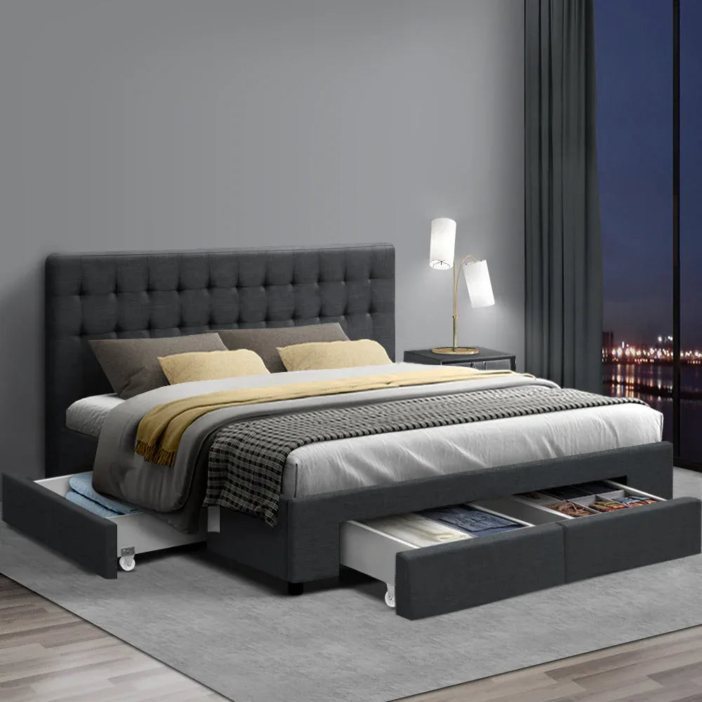 King bed with charcoal tufted headboard and fabric storage drawers in modern bedroom setup with neutral decor.