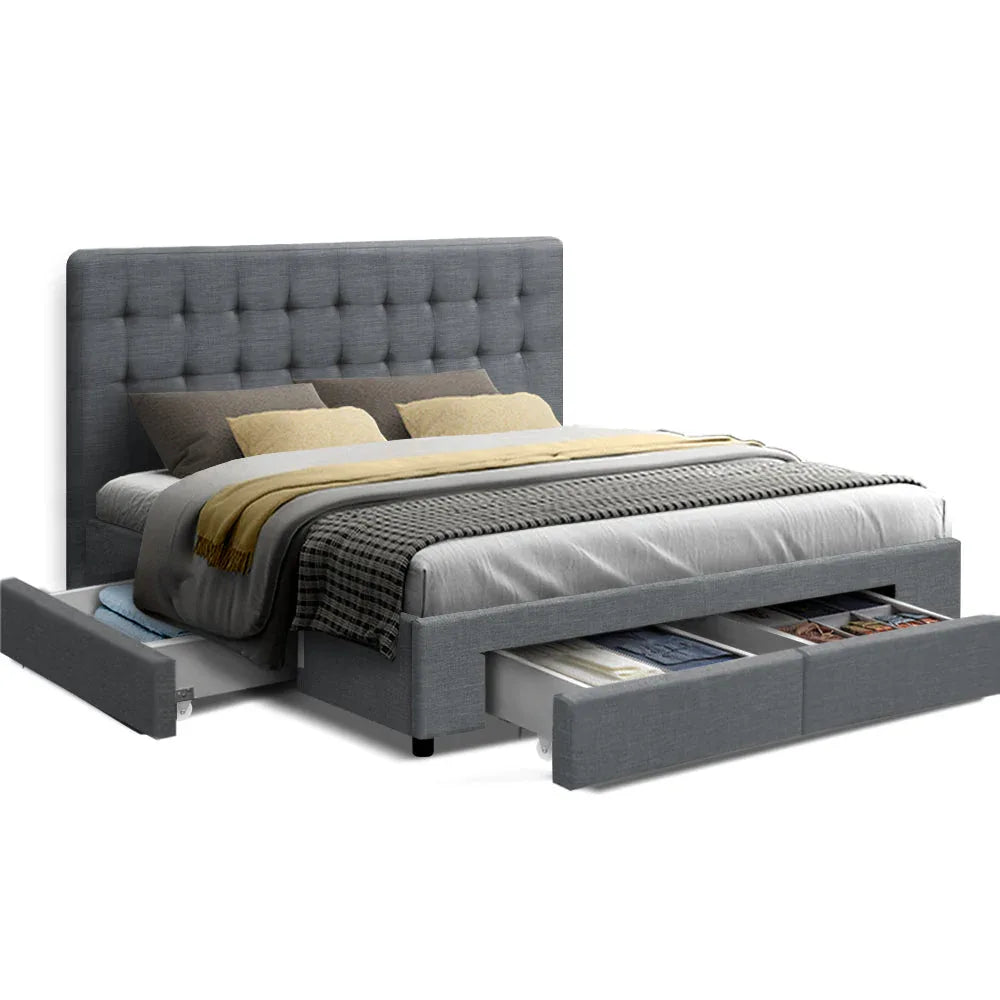 Grey queen bed frame with tufted headboard and fabric upholstery in a bedroom setting.