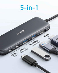 Angled view of black refurbished Anker USB-C hub highlighting USB and HDMI ports.