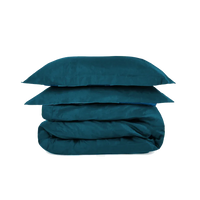 Teal super king duvet set from The House Babylon Collection displayed neatly on a bed, showing smooth 600-thread count cotton