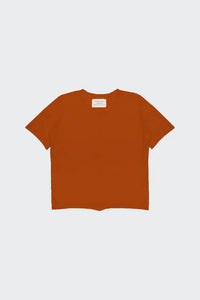 Front view of burnt orange gender neutral short sleeve top for children
