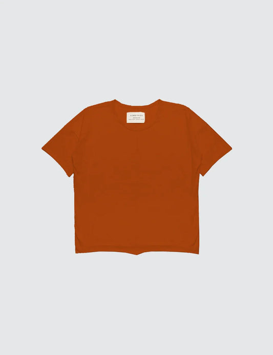 Burnt orange short sleeve top for kids, displayed on a plain white background.