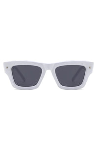 Black square sunglasses angled to show frame curves and lens color.
