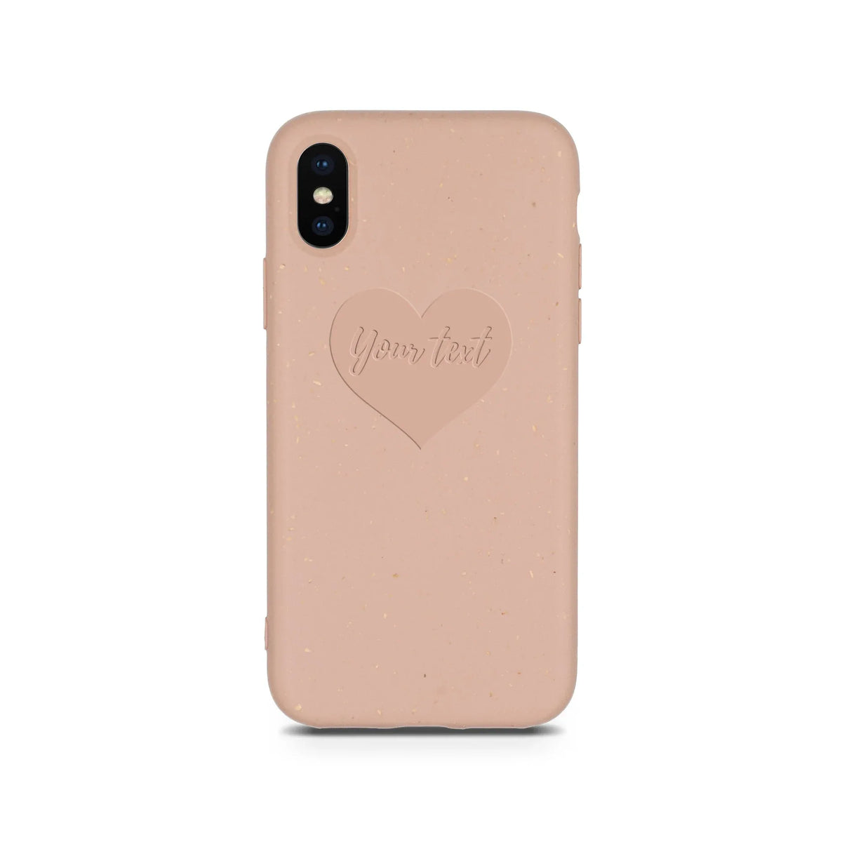 Close-up of compostable pastel pink phone case featuring a small engraved heart design.