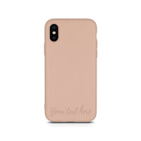 Horizontal view of personalized compostable pastel pink phone case for iPhone XS.