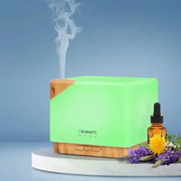 DEVANTi Aroma Diffuser beside essential oil bottle and decorative items