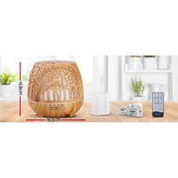 Close-up of the Ultrasonic aroma diffuser showing woodgrain texture and soft glowing light