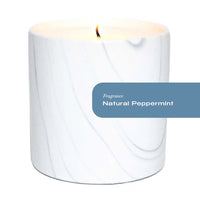 Close-up of white marble ceramic vessel with gray and black swirls for peppermint scented candle.