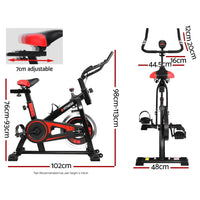 Side profile of black spin bike highlighting pedals and seat