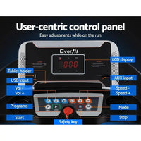Treadmill displaying digital speed and workout data on LCD screen in bright lighting