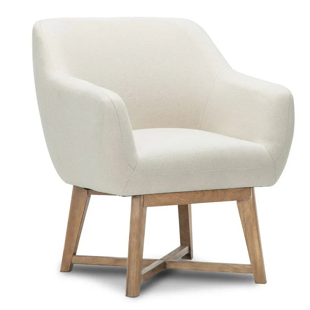 Back view of beige armchair revealing solid rubber wood legs and criss-cross base