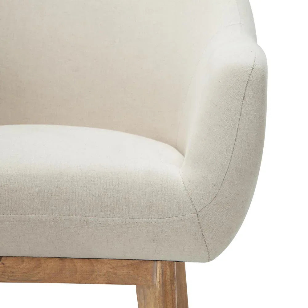 Detailed shot of armchair leg made of solid rubber wood with natural finish