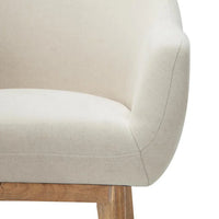 Detailed shot of armchair leg made of solid rubber wood with natural finish