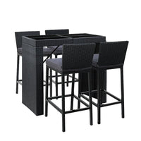 Gardeon Outdoor Bar Set with rattan stools and glass tabletop on a wooden deck