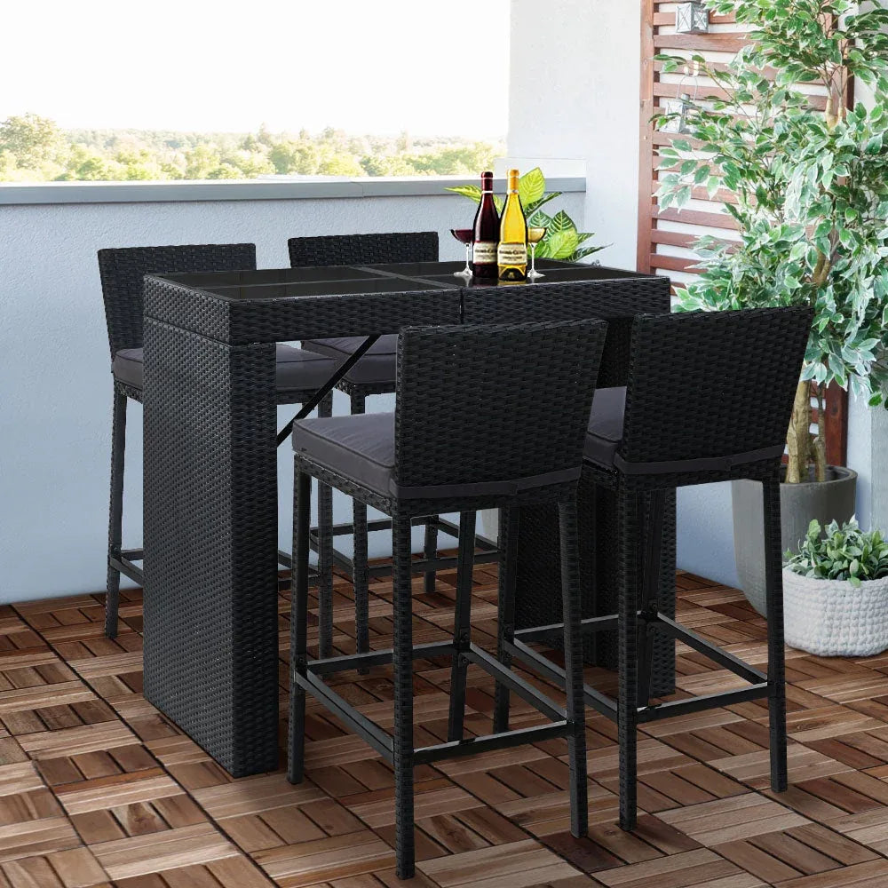 Close-up detail on rattan weave and foam cushions of outdoor bar stools