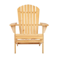 Folded wooden Adirondack chair packed next to a woven basket on a beach setting.