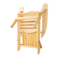 Top view of folded wooden Adirondack chair leaning against a beach umbrella stand.