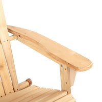 Wooden foldable beach chair set against natural stone wall in sunny garden.