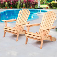 Wooden patio chair folded and resting on light wooden deck outdoors.