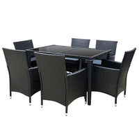 Side view of cushioned black rattan chair highlighting foam seat and sleek aluminum frame