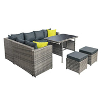 Side angle of outdoor wicker sofa with thick cushions and powder-coated steel frame.