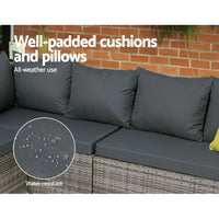 Close-up of dark synthetic wicker weave on outdoor sofa with light gray cushions.