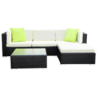 Gardeon outdoor sofa set with glass-top table and cushioned seats under sunlight
