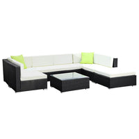 Gardeon 8PC sofa set arranged outdoors with glass-topped coffee table and additional corner table.