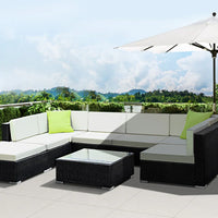 Gardeon sofa set with cushions on patio, showing spacious seating and water-resistant materials.