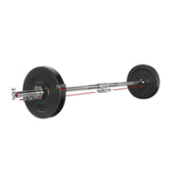 Close-up of black rubber-coated 5kg barbell weight plates stacked beside chrome bar