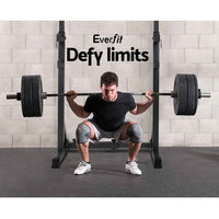 High angle view showing durable powder-coated steel squat rack stands on gym floor.