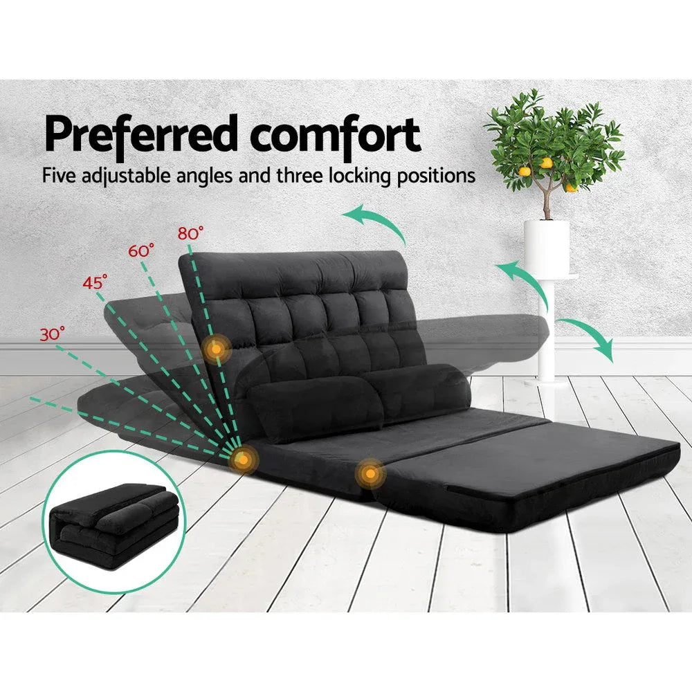 Charcoal lounge sofa bed folded into a seat with backrest at an angle on floor.