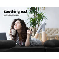 Charcoal lounge sofa bed in a relaxed reclined position with padded cushions visible.