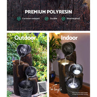 Black solar-powered garden fountain showing water cascading gently through all three tiers.