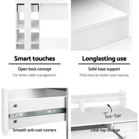 White computer desk fully assembled with storage shelves and keyboard tray.