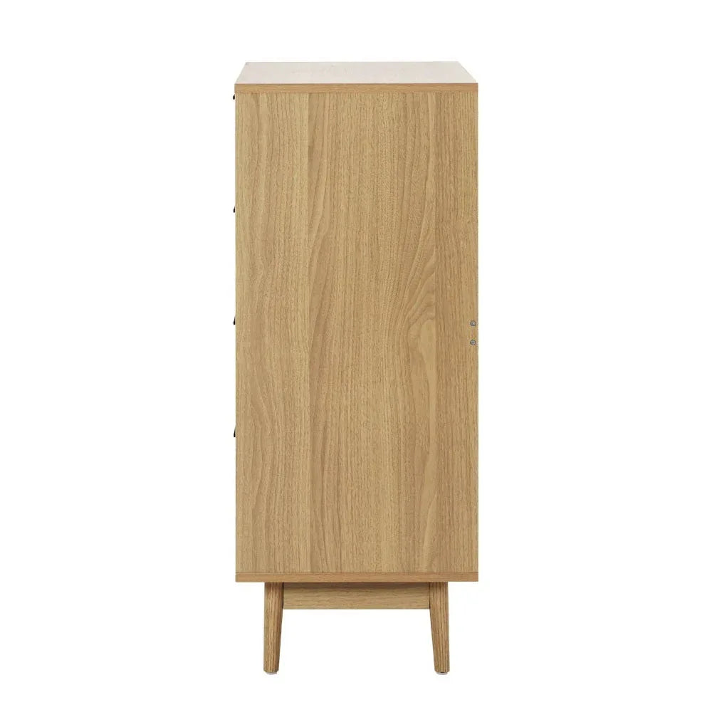 Rattan tallboy chest with four spacious drawers open, displaying interior storage capacity.