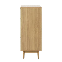 Rattan tallboy chest with four spacious drawers open, displaying interior storage capacity.