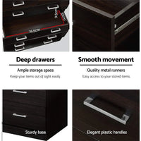 Close-up of metal drawer runners ensuring smooth operation in walnut cabinet.