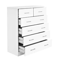White Artiss tallboy dresser with six drawers and sleek modern handles in a bright room.