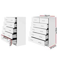 Side view of white tallboy dresser showing smooth drawer fronts and metal runners.