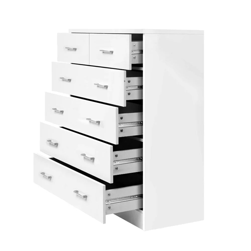 Top drawer of tallboy dresser partially open to show smooth sliding mechanism.