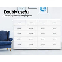 White dresser with six drawers placed in modern bedroom setting.