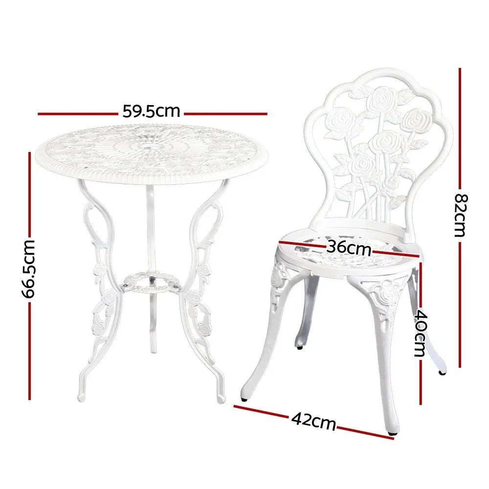 Close-up of white aluminium outdoor chair with floral motif and armrests on wooden floor.