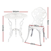 Close-up of white aluminium outdoor chair with floral motif and armrests on wooden floor.